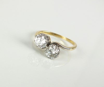 Lot 60 - A two stone diamond crossover ring