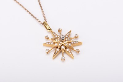 Lot 107 - A late 19th century diamond and pearl set starburst pendant on chain