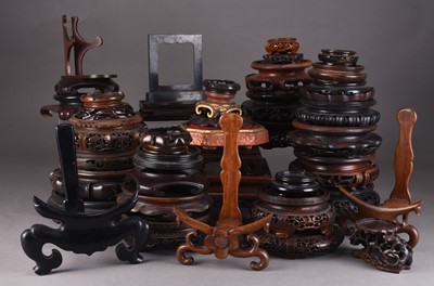 Lot 140 - A collection of Chinese carved hardwood vase, plate and curio stands, mainly Qing Dynasty