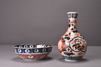 Lot 197 - A Japanese Imari bottle vase and an Imari bowl