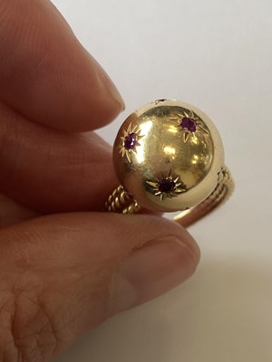 Lot 50 - A pair of ruby set orb rings