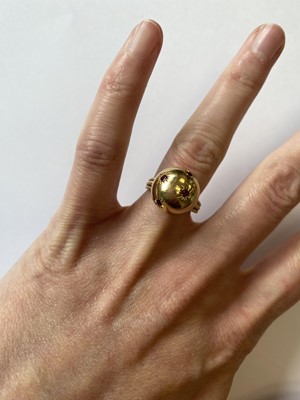 Lot 50 - A pair of ruby set orb rings