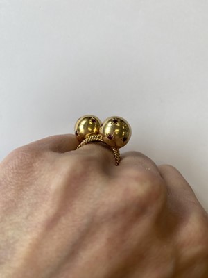 Lot 50 - A pair of ruby set orb rings
