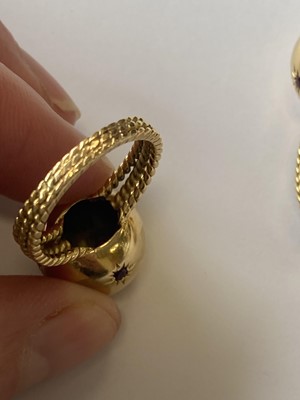 Lot 50 - A pair of ruby set orb rings