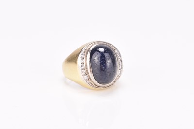 Lot 296 - A cabochon sapphire and diamond ring