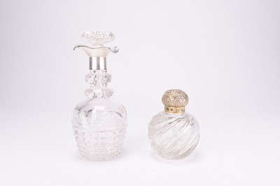 Lot 73 - A silver topped dressing table bottle and a silver mounted decanter