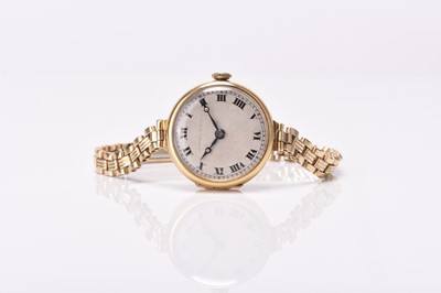 Lot 318 - Tavannes Watch Co: A lady's 18ct gold wristwatch on rolled gold bracelet