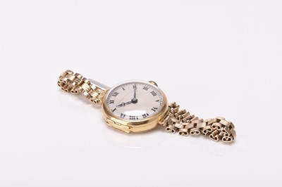 Lot 318 - Tavannes Watch Co: A lady's 18ct gold wristwatch on rolled gold bracelet