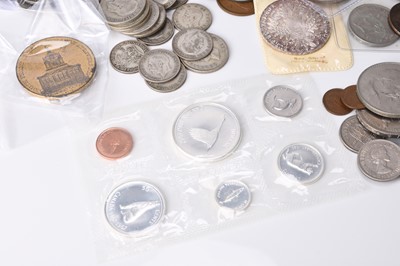 Lot 172 - A small collection of UK and foreign silver, cupro-nickel, copper and bronze coinage to include Canada, USA and European etc. (Quantity)