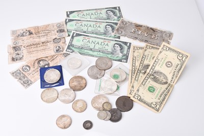 Lot 172 - A small collection of UK and foreign silver, cupro-nickel, copper and bronze coinage to include Canada, USA and European etc. (Quantity)