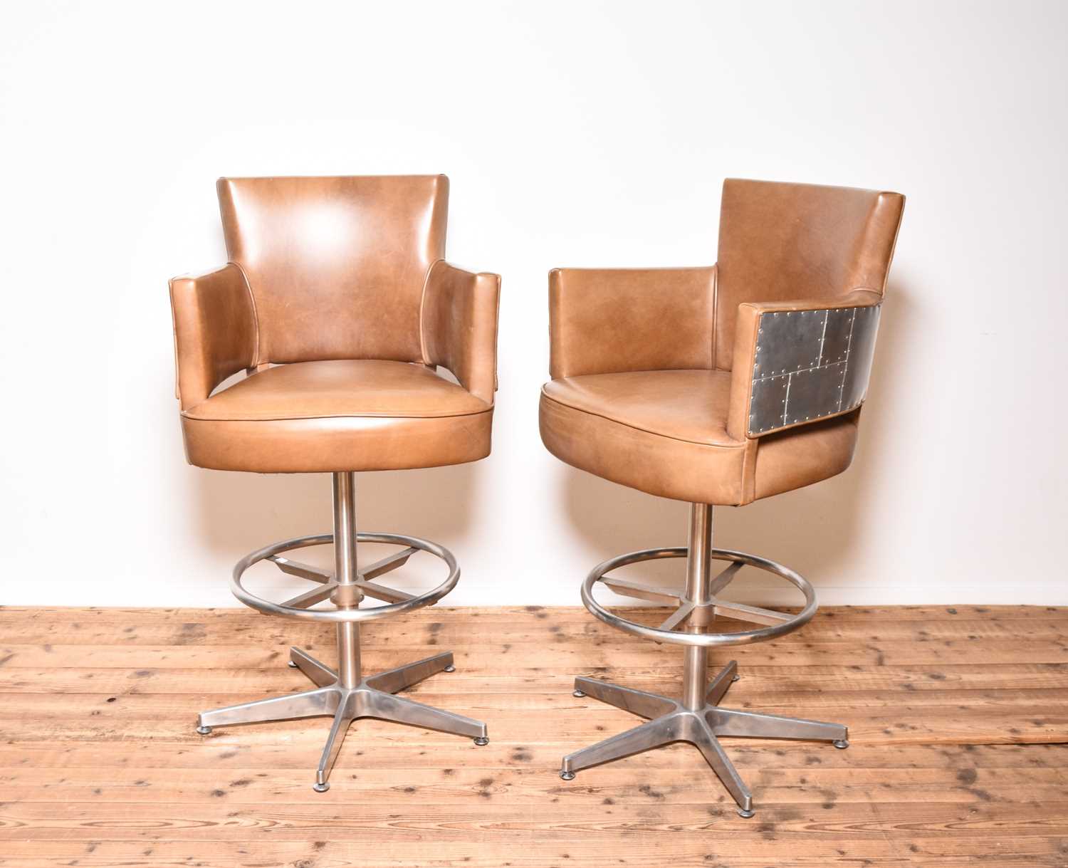 Lot 230 - Timothy Oulton, a pair of swing bar stools