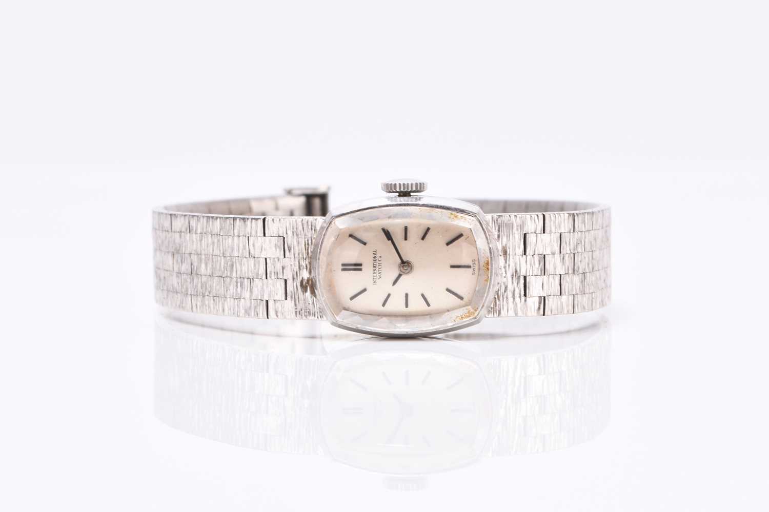Lot 66 - IWC: A lady's 18ct white gold bracelet watch