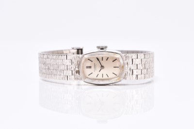 Lot 66 - IWC: A lady's 18ct white gold bracelet watch