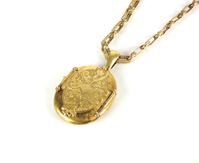 Lot 41 - A Victorian yellow metal oval locket suspended from gold decorative link chain