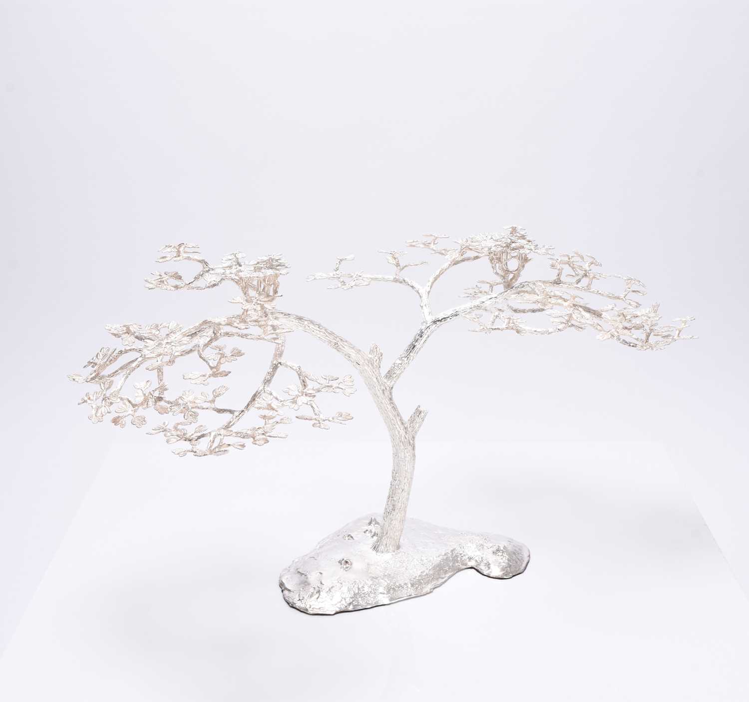 Lot 14 - A Patrick Mavros silver 'Fari' Acacia tree candle holder / table ornament