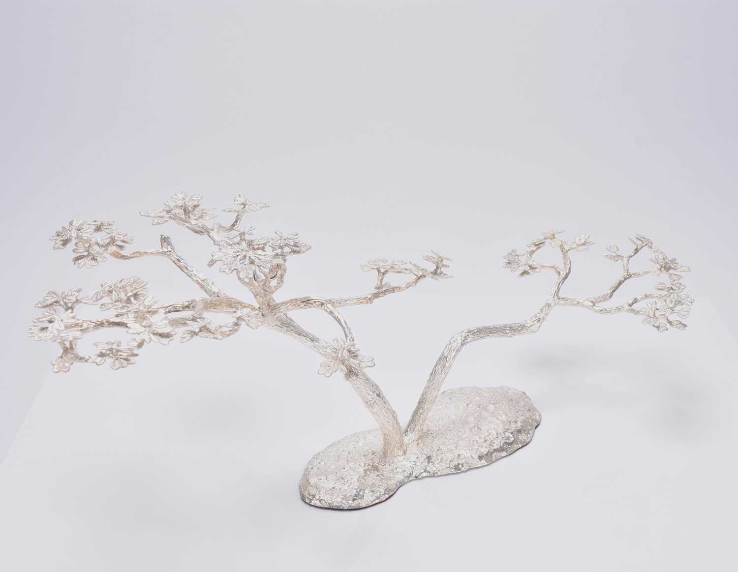 Lot 12 - A Patrick Mavros silver 'Fari' Acacia tree candle holder / table ornament