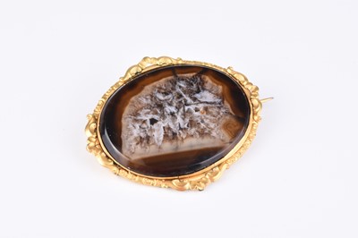 Lot 202 - A late 19th century oval hardstone brooch