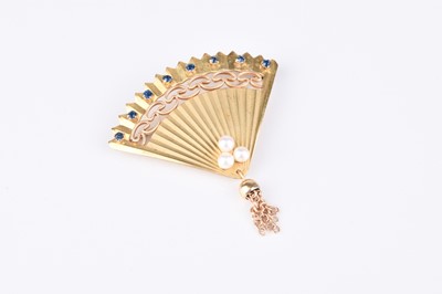 Lot 103 - A yellow metal cultured pearl and blue stone set brooch in the form of a fan