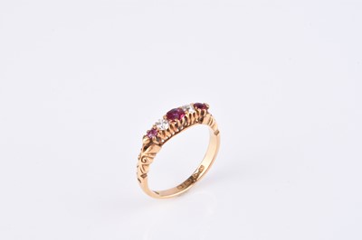 Lot 175 - An 18ct gold five stone diamond and ruby ring