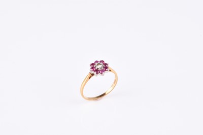 Lot 99 - A ruby and diamond floral cluster ring