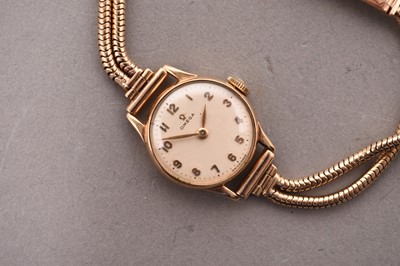 Lot 320 - Omega: A lady's 9ct gold bracelet watch