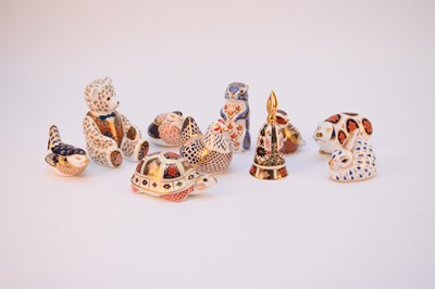 Lot 574 - Nine Royal Crown Derby imari paperweights and one small imari bell