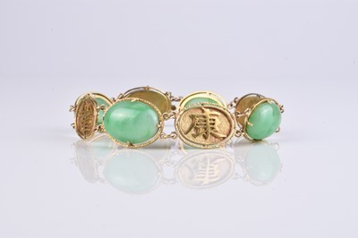 Lot 50 - A Chinese yellow metal and jadeite panel bracelet