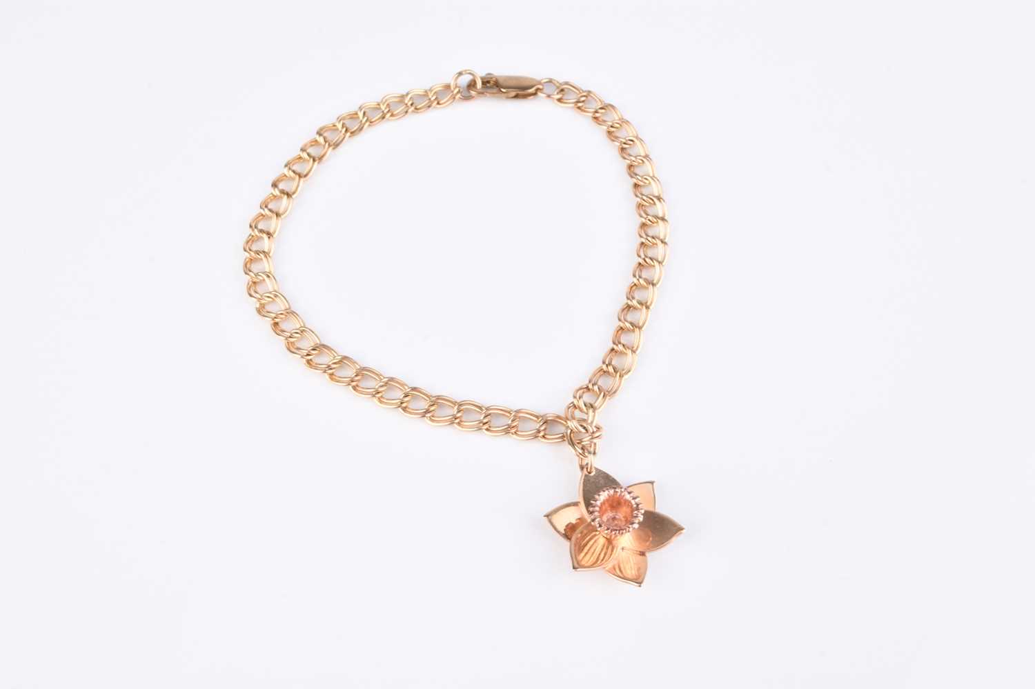 Lot 157 - A Clogau 9ct gold Daffodil charm bracelet
