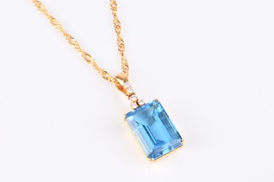 Lot 261 - A blue topaz and diamond pendant on chain