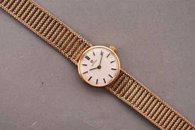 Lot 321 - Omega: A lady's 9ct gold bracelet watch