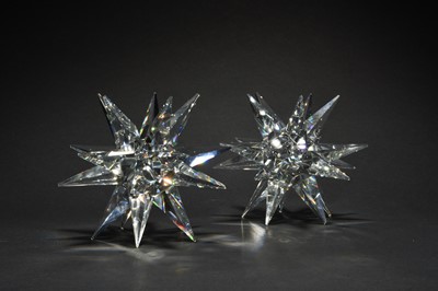 Lot 593 - A pair of boxed Swarovski Crystal star candleholders
