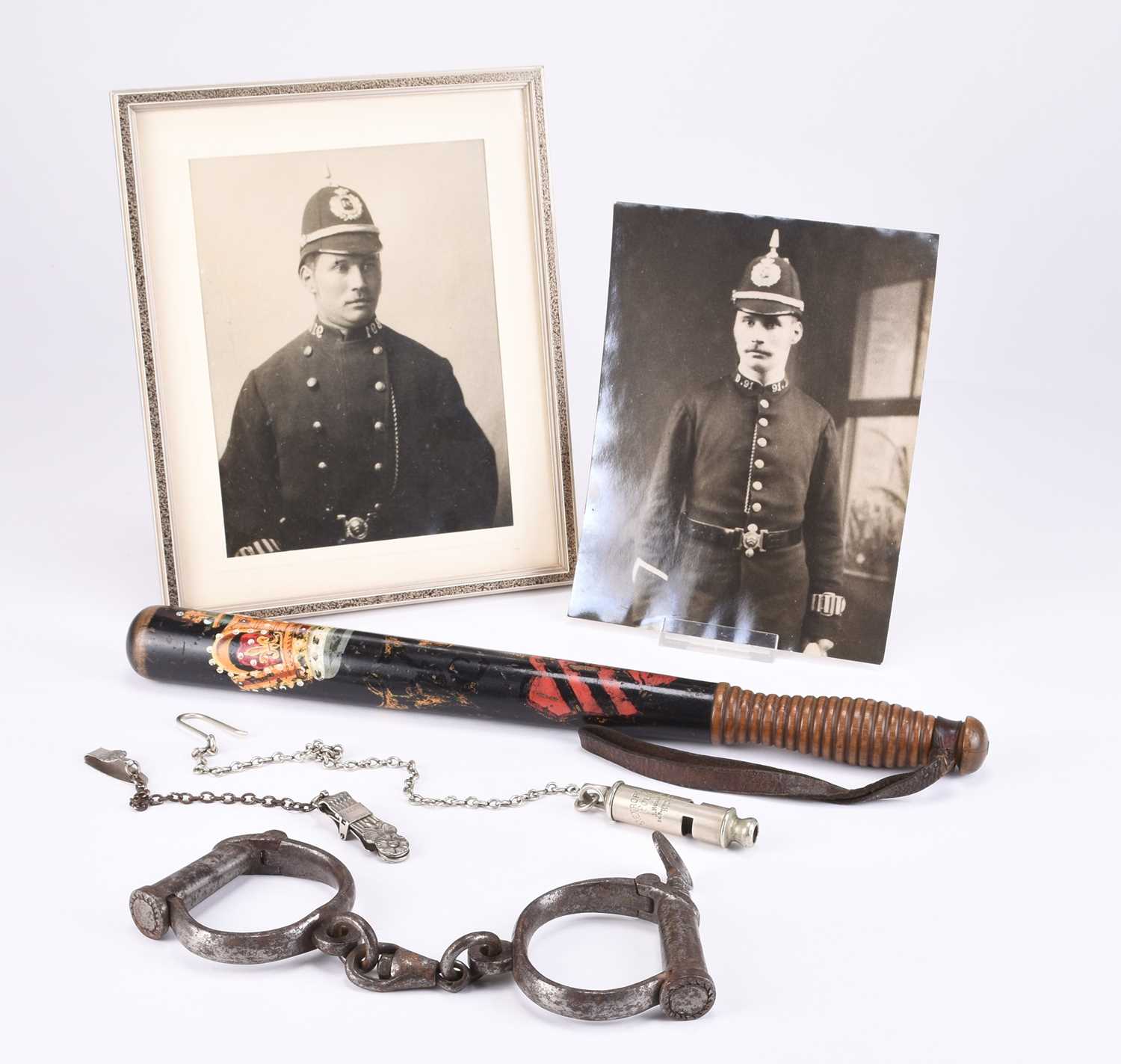 Lot 57 - POLICE INTEREST - Met Police whistle, handcuffs, Victorian truncheon, two portrait photographs