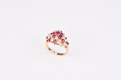 Lot 213 - A ruby and diamond cluster ring