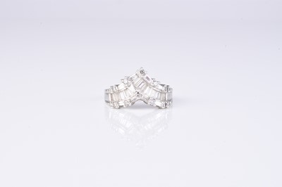 Lot 56 - A graduated tapered baguette cut diamond ring