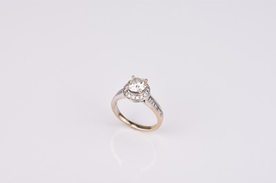 Lot 166 - A brilliant cut diamond halo ring