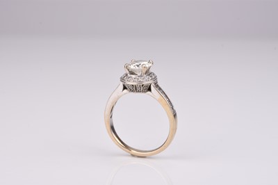 Lot 334 - A brilliant cut diamond halo ring