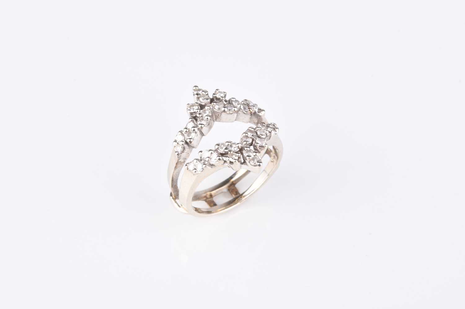 Lot 187 - A diamond set double herringbone ring
