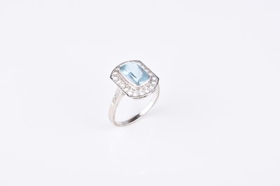 Lot 137 - An 18ct white gold aquamarine and diamond cluster ring