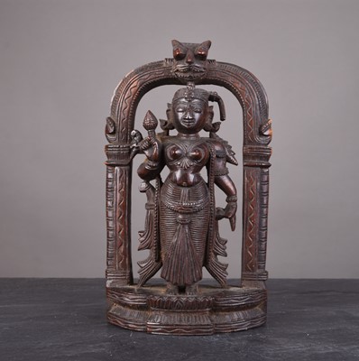 Lot 275 - An Indian carved wood figure of a deity