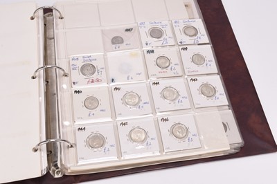 Lot 213 - A red coin album containing large collection of UK and USA