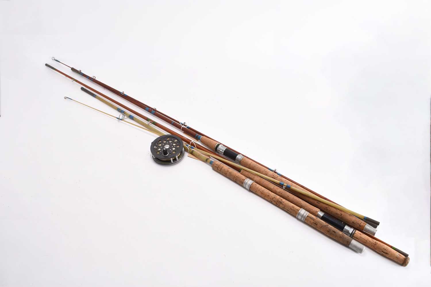 Lot 129 - Two vintage cane fly rods, a vintage glass fibre rod and a Shakespeare reel