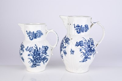 Lot 14 - Two Caughley 'Bouquets' cabbage leaf maskhead jugs, circa 1785