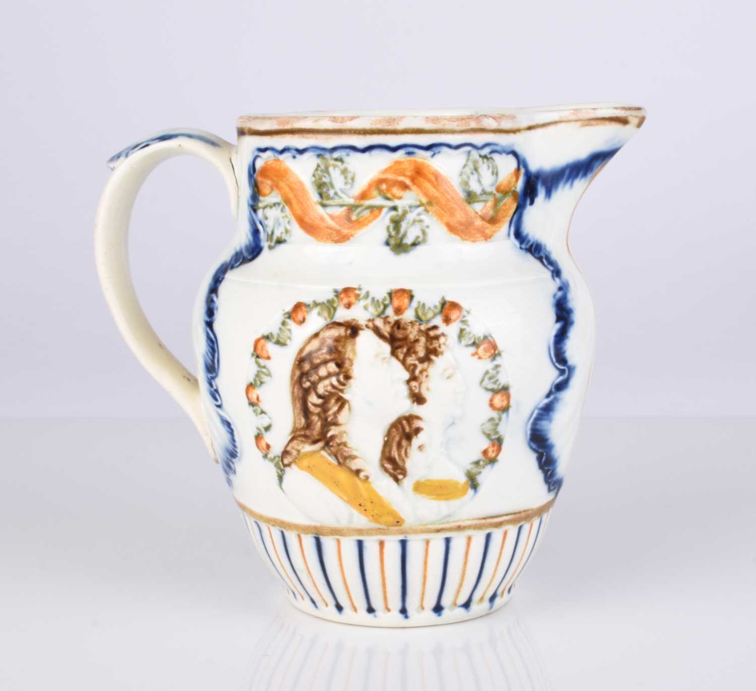 Lot 486 - A small English prattware 'Duke of York / Royal Sufferers' jug, circa 1796-1800