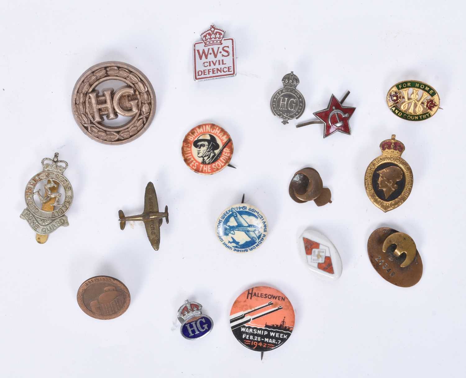 Lot 65 - A group of military-related badges together with a post-war DPM British Army sniper's smock