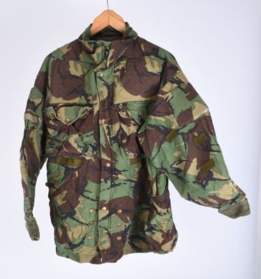 Lot 65 - A group of military-related badges together with a post-war DPM British Army sniper's smock