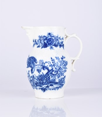 Lot 453 - A small Caughley 'Parrot Pecking Fruit' cabbage leaf maskhead jug, circa 1780-85