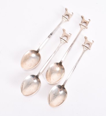 Lot 1 - A set of four silver teaspoons with cast hound finials