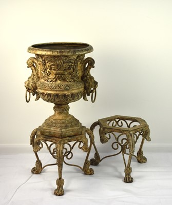 Lot 419 - A reproduction cast alloy garden urn with two stands