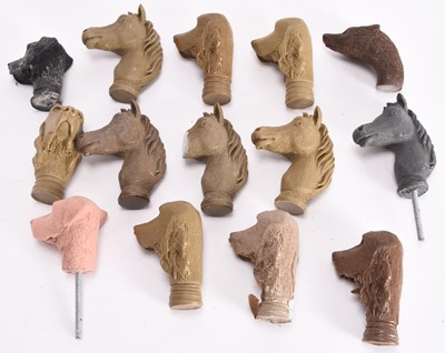 Lot 128 - A collection of cast resin animal stick heads