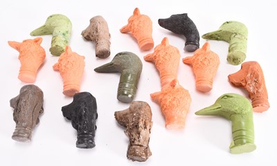 Lot 116 - A collection of cast resin animal stick heads